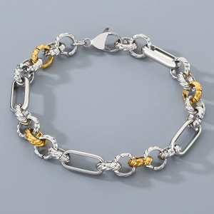 Close-up of two-tone stainless steel cable chain bracelet with lobster clasp detail