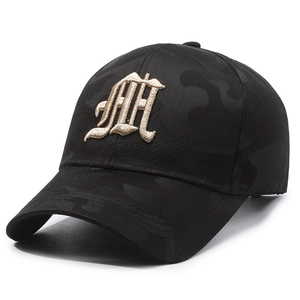 Dark camo baseball cap featuring gold gothic embroidery and a breathable mesh texture