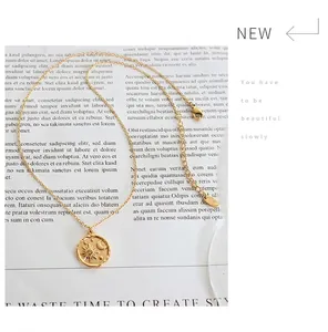 Detailed macro view of gold-plated sun and moon pendant with S925 engraved stamp