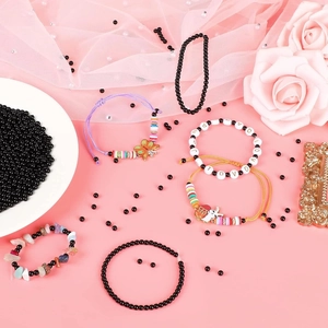 Flat lay of colorful beaded bracelets with rabbit charms and gold spacer beads decoration