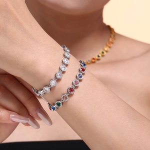 Polished titanium steel bracelets with colorful 3A zircon stones on a model's wrist