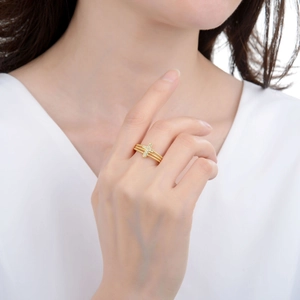 Elegant gold multi-layer cross ring with zircon stones shown on finger for women