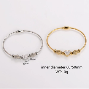 Stainless steel cable bracelet with pave heart charm and magnetic clasp in gold and silver