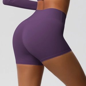 Close-up of deep purple high-waisted yoga shorts with seamless butt lifting design