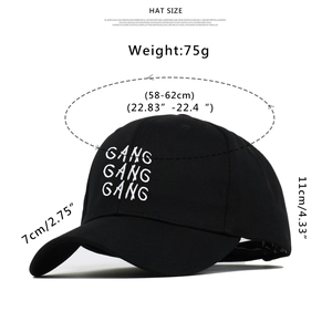 Detail view of black cotton baseball cap showing GANG embroidery and 75g weight info