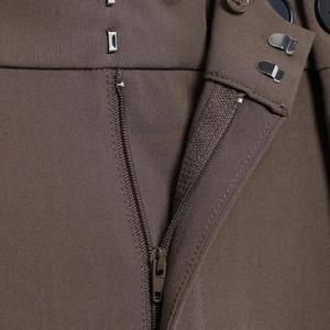 Brown high-waisted dress pants with twill fabric texture and metal zipper closure