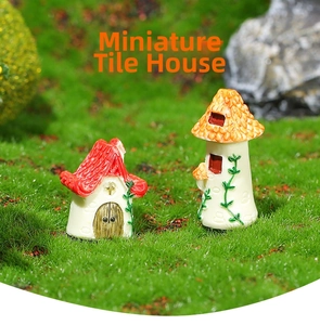 Close-up of red and orange miniature resin fairy garden houses with green vine details