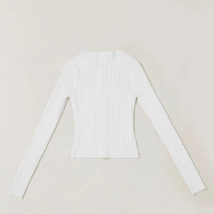 Detailed back view of white ribbed knit cardigan with slim-fit texture and long sleeves
