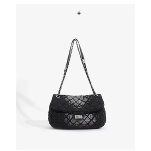 Quilted black hobo bag with gold chain strap and metallic twist lock on white background