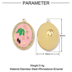 Detail view of pink enamel flower charms with green leaves and crystals on gold steel