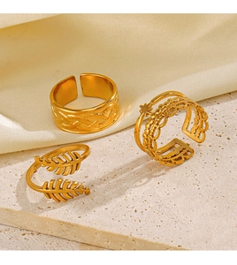 Three-piece gold adjustable ring set with woven leaf and star bead textured designs
