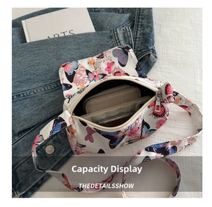 Interior view of butterfly print crossbody bag showing storage capacity and space layout