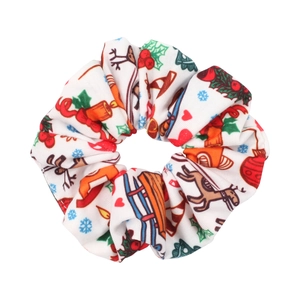 Detail of Christmas scrunchie with colorful reindeer, snowflakes, and festive patterns