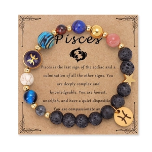 Detailed top view of a Pisces solar system bracelet with lava stone on a brown card