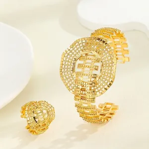 Detailed macro view of Middle Eastern style hollow mesh gold plated bridal bracelet and ring