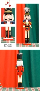Detail view of wooden nutcracker soldier featuring drumsticks and gold sequin accents