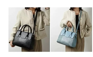 Detail of crocodile embossed handbags in black and light blue with trapezoid design