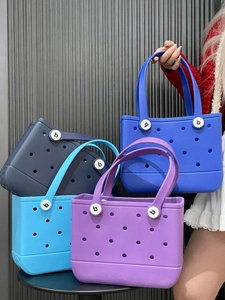 Detail of waterproof EVA beach tote bags showing multi-hole design and sturdy white buttons