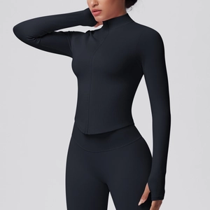 Detail of black ribbed yoga jacket with stand collar zipper and thumbholes on sleeve cuffs