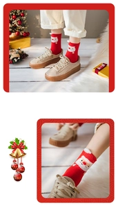 Detail of red Christmas crew socks featuring Santa Claus pattern in festive home setting