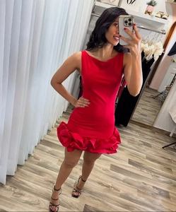 Detailed mirror selfie of a red sleeveless mini dress with ruffled hem and halter neck