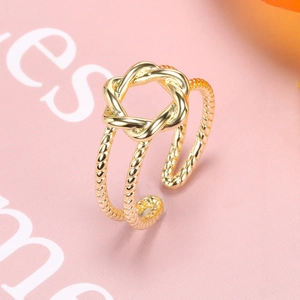 Macro shot of 18k gold plated braided double-layer hollow geometric open ring detail