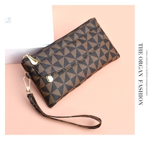 Detail of checkered PU leather clutch bag featuring zipper closure and wrist strap