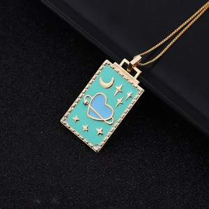 Vintage gold tarot card necklace with turquoise enamel heart and moon star pendant