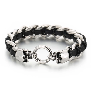 Men's punk skull braided leather bracelet with stainless steel accents on white background