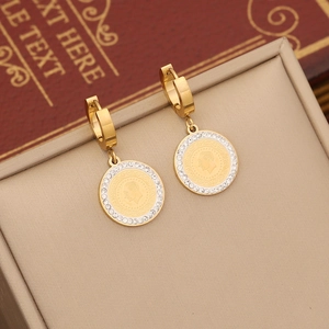 Gold coin earrings with male portrait relief and zircon halo on beige leather box
