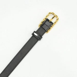 Women's black PU leather belt featuring a vintage gold twist buckle on a white background