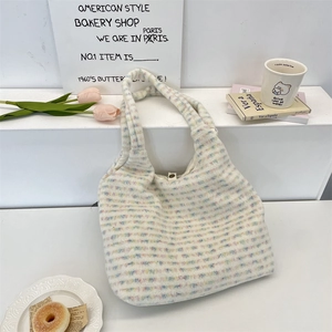 Close-up of fluffy pastel striped tote bag with colorful tulips and French decor