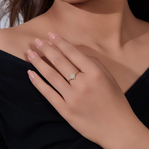 Macro detail of gold plated S925 silver north star ring with cubic zirconia micro-pave