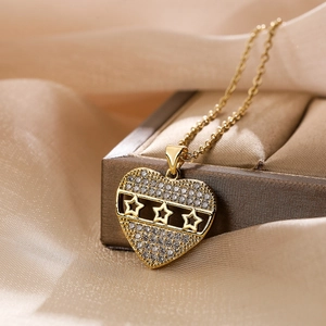 Gold plated heart pendant necklace with white zircons on elegant champagne silk ribbon