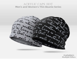 Detail of black and gray thin acrylic beanies featuring handwritten letter patterns