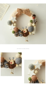 Detail of Christmas wreath with reindeer, gnome, pine cones and warm LED string lights