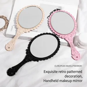 Elegant European vintage handheld makeup mirror with embossed patterns in various colors