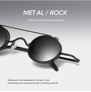 Close-up of punk style black metal oval sunglasses with high-quality nose pads and frame details