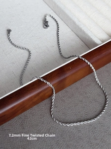 Detailed view of a 7.2mm wide silver twisted chain necklace with 42cm length specification