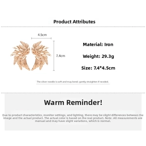 Detailed spec sheet showing oversized gold wing earrings with 7.4cm length and 29.3g weight