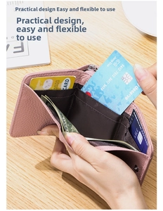 Interior detail of pink leather trifold wallet showing multi-card slots and coin pocket