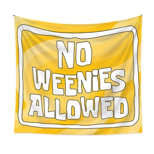 Detail of hanging yellow bohemian tapestry featuring bold NO WEENIES ALLOWED lettering