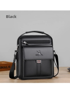 Close-up of black pebble leather shoulder bag featuring embossed logo and metal hardware