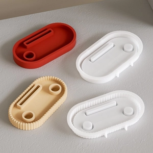 Macro detail of oval silicone molds with smooth and wavy edges for DIY resin trays
