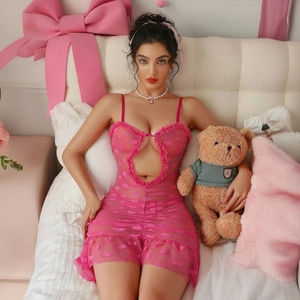 Close-up of pink lace lingerie with heart print, mesh fabric, and ruffle details