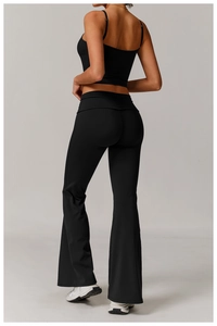Rear view detail of a black yoga set with cropped sports top and flared yoga leggings