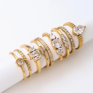 7-piece 18K gold plated stainless steel ring set with zircon stones on white display
