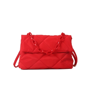 Chic red quilted puffer shoulder bag with stylish acrylic chain strap and sleek crossbody strap