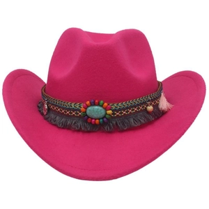 Detail of rose red felt cowboy hat featuring ethnic beads, turquoise stones and tassels