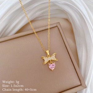 Detail showing bow pendant with pink heart gemstone and 40+5cm chain specifications